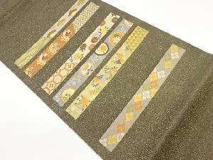 横段に花々・蝶・古典柄模様織出し袋帯